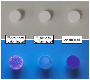 3 Integrating sphere reference plugs - the left hand side is contaminated with a fluorophore, the middle is contaminated with a finger print and the right hand side is air exposed. 